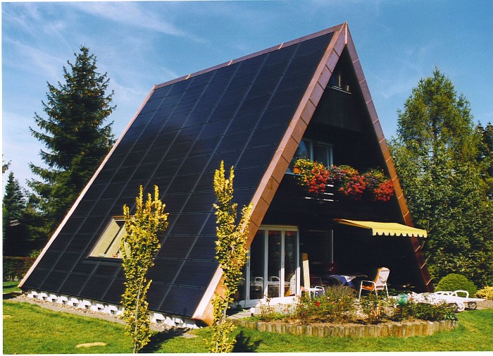 A-frame house with complete solar panel coverage